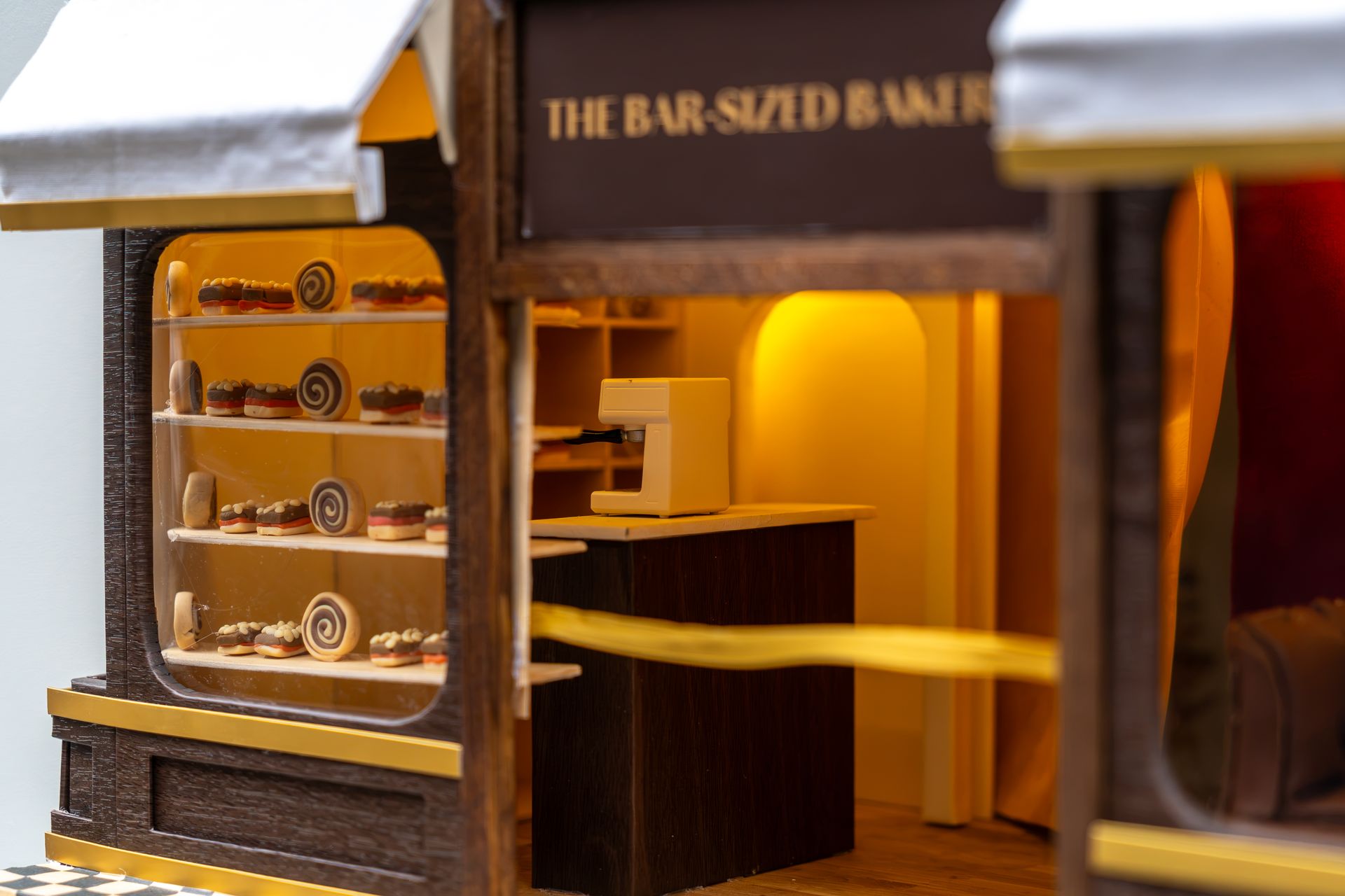 Close-up of the miniature bakery's shopfront and shelves