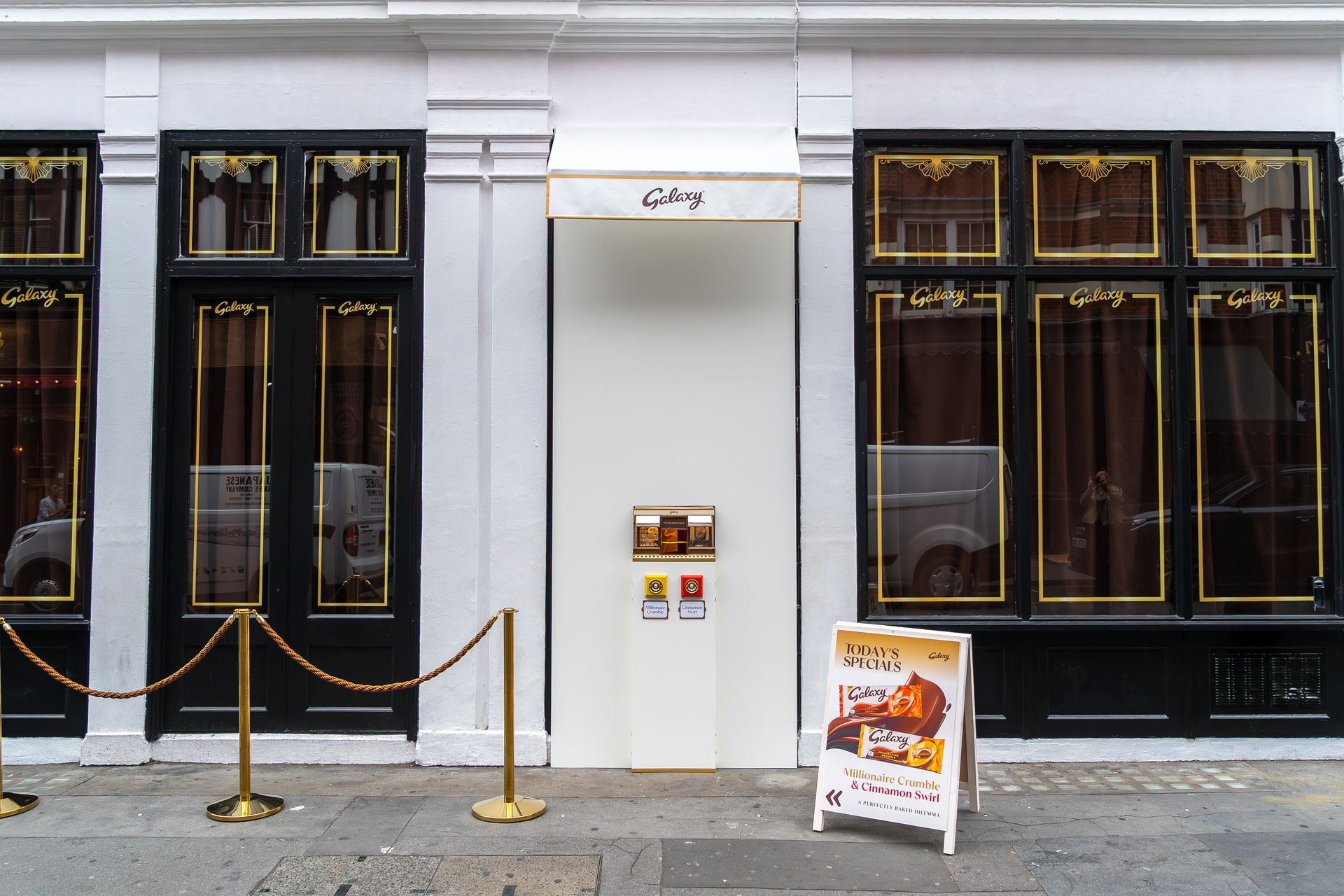The Bar-Sized Bakery pop-up on a Soho street, with the miniature bakery on a stand by the door
